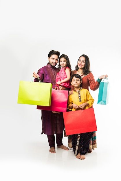 Family Celebrating Diwali, Shop Banner Design, Ms Dhoni Photos, Indian Family, Indian People, Diwali Festival, Business Portrait, Shopping Photography, Frocks For Girls