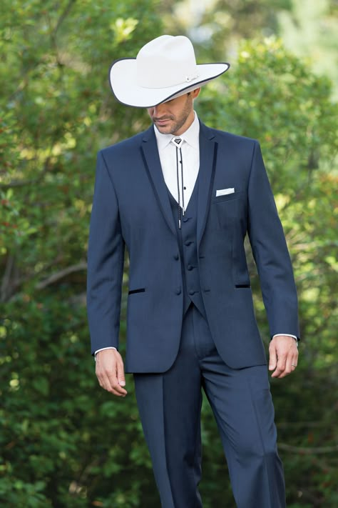 Wear a bolo or string tie to complement the country theme. And don’t forget the cowboy hat and boots! Mens Western Suits Country Weddings, Navy Cowboy Wedding, Cowboy Outfit Wedding, Men Wedding Outfit Western, Bolo Tie Tuxedo, Cowboy Formal Wear Men Western Weddings, Western Tuxedo Cowboys, Elegant Cowboy Outfit For Men, Navy Blue Suit Wedding Cowboy Boots