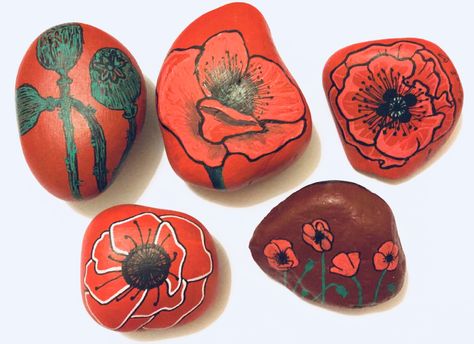 Remembrance poppy flower painted pebbles Remembrance poppy flower painted rocks Remembrance Poppy Flowers Remembrance Craft, Making Poppies, Flower Painted Rocks, Patriotic Rocks, Memorial Rocks, Poppy Flower Painting, Remembrance Day Art, Poppy Craft, Remembrance Day Poppy