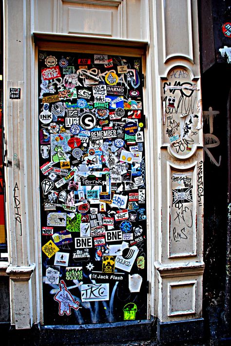 Sticker-filled door in a coffe shop in Amsterdam Stickers On Door Aesthetic, Amsterdam Shopping, Open Sesame, The Doors Of Perception, Vintage Cupboard, Future Room, Graffiti Stickers, Bedroom Setup, Sticker Bomb