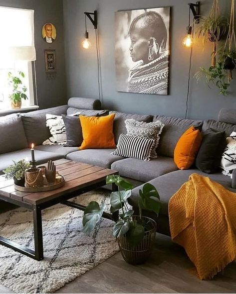 a boho living room with graphite grey walls, a grey sectional, grey, white and yellow bedding, a wooden table and potted plants Gray Sectional Living Room, Grey And Yellow Living Room, Grey Walls Living Room, High Ceiling Living Room, Grey Couch Living Room, Wooden Living Room, Living Room Decor Gray, Yellow Living Room, Living Room Decor Cozy