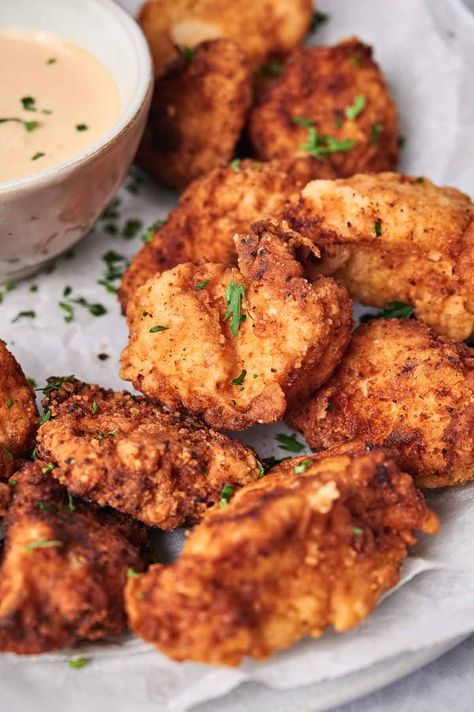 Fried Chick-fil-A chicken nuggets served with dipping sauce and garnished with parsley. Healthy Chick Fil A Nuggets, Chic Fil A Grilled Nuggets Recipe, Copy Cat Chic Fil A Nuggets, Chik Fil A Chicken Nuggets Airfryer, Weight Watchers Copycat Chick Fil A Nuggets, Chik Fil A Chicken, Chick Fil A Chicken Nuggets, Crispy Chicken Nuggets, Chick Fil A Recipe