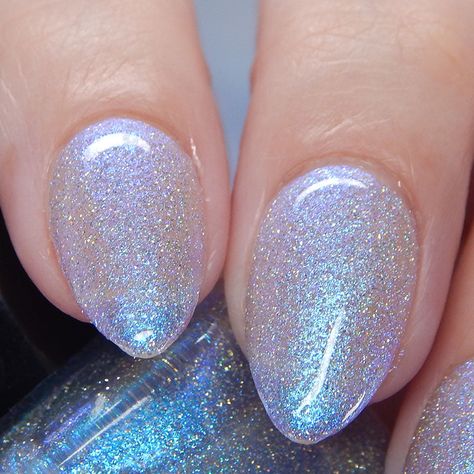 This one is a teal/blue shimmer polish that also has silver reflective glitters that become incredibly flashy when under bright lights. The micro ultra holographic glitters add an extra pop of sparkles. Glitter Whisperer and Quick Dry Top Coat are recommended to help the shimmers shine and the glitters sparkle! Name: Choose Happiness Type: Shimmer, Reflective Glitter # Recommended Coats: 2-3 Sizes Available: 15ml Shimmery Light Blue Nails, Blue Sparkly Winter Nails, Light Blue Nails With Sparkle, Blue Nail With Glitter, Shimmer Nail Ideas, Blue Pearlescent Nails, Silvery Blue Nails, Sparkle Winter Nails, Light Glitter Nails