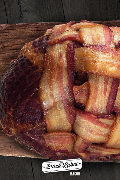 Bacon-Wrapped Ham | Every main dish should be wrapped in bacon. | Make sure your holiday ham is dressed up – in its bacon suit. Thanks to DudeFoods.com for this epic example. Baked Country Ham, Cooking Ham In Oven, Spiral Ham On Pellet Grill, Oven Bacon Perfect, Turkey In Roaster Oven, Smoked Spiral Ham On Pellet Grill, Ham Sauce, Smoked Ham Recipe, Bacon Wrapped Conecuh Sausage