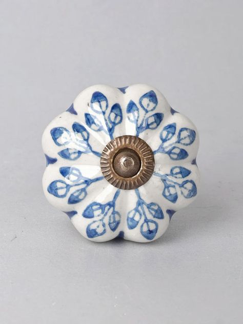 Blue Flower design On White Base Ceramic Door Knob is beautifully hand painted knob that revitalizes the entire look of your room instantly. The flowered knob doesn't fail to add the natural hint to your home with the personal touch. It is perfectly suitable for any cabinet or drawer in your kitchen, bathroom or even your dressing. Being handmade it gives you a very personal and elegant appearance to your drawers or cabinets. These uniquely crafted ceramic knobs are 4.57 cm in diameter and also White Kitchen Knobs, Grey Bathroom Cabinets, Ceramic Cabinet Knobs, Blue White Kitchens, Blue Flower Design, Interior Door Knobs, Bedroom Cabinet, Ceramic Door Knobs, Vintage Knobs