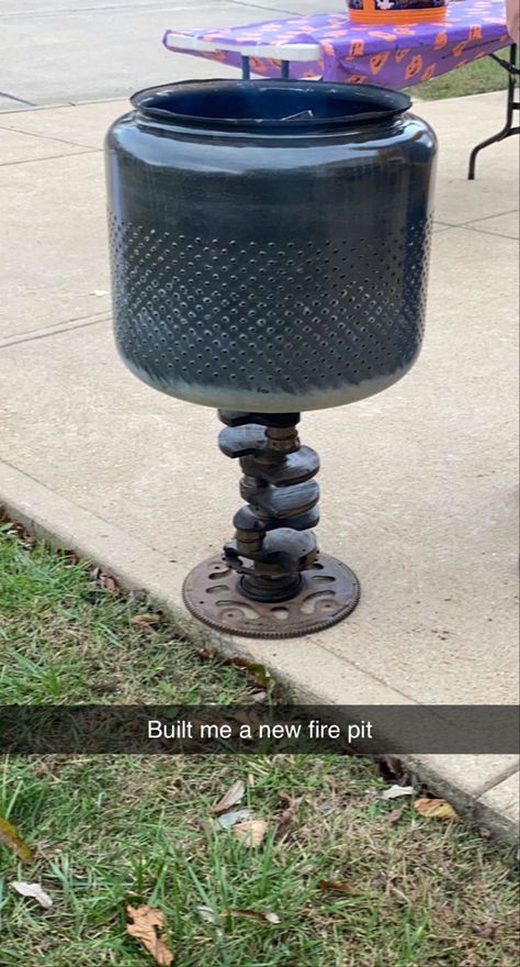 Found a washing machine tub and a camshaft Ed with a flywheel attached to it still in the junk yard. I had plans to make a stand for the tub to have a different stand but as I gandered around the junkyard I came across the camshaft and thought it would make a awesome looking fire pit and cause I’m a car guy, it just made sense. 1 bolt I found also holds the tub to the shaft so when your ready to build a fire, you can attach the two parts together. Washer Tub Fire Pit, Small Craft Ideas, Fire Pit Ideas, Backyard Garden Design, Backyard Fun, Fire Pits, The Stand, A Fire, Easy Storage