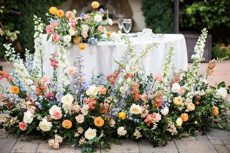 Colorful Sweetheart Table Flowers, Summer Color Wedding Theme, Where To Put Flowers At Wedding, Spring Garden Wedding Flowers, 2023 Wedding Florals, Wedding Flowers Multicolor, Bright Spring Wedding Florals, Head Table Florals Wedding, Outside Wedding Decorations Summer