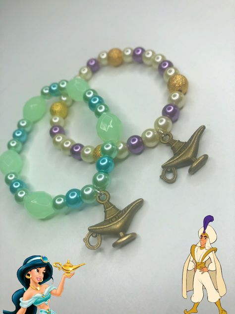 The perfect couple make a magical pair of bracelets. Each represents their own character completed with a genie lamp charm. This is the perfect gift for any disney fan. *3 wishes not included* #disney #aladdin #princess #jasmine #genie #lamp #bracelet #jewellery #charm #bead Lamp Bracelet, Disney Princess Bracelet, Aladdin Cast, Aladdin Theme, Aladdin Princess Jasmine, Cast Gifts, Aladdin Princess, 3 Wishes, The Perfect Couple