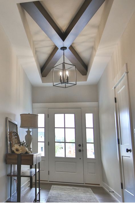 Adding some focal interest to the ceiling of this farmhouse was a fun project. Not an overwhelming detail but clean, strong lines bring some excellent character to this foyer. Tray Ceiling Foyer, Foyer Beams Entryway, Foyer Ceiling Design, Foyer Ceiling Ideas, Modern Farmhouse Style Living Room, Foyer Ceiling, Bungalow Interior Design, Farmhouse Foyer, Foyer Ideas Entryway