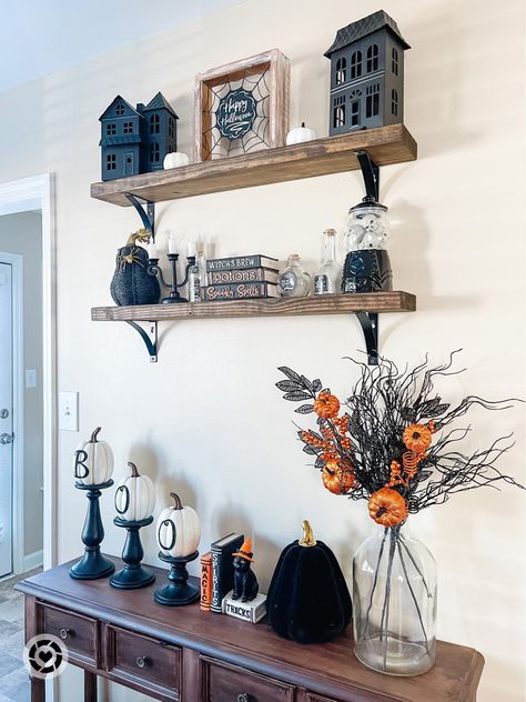 Halloween styled shelves Fall styled shelves Fall home decor Halloween decor Follow my shop @BlogsbyAria on the @shop.LTK app to shop this post and get my exclusive app-only content! #liketkit #LTKSeasonal #LTKhome #LTKHalloween @shop.ltk https://liketk.it/3PskE Halloween Decor For Shelves, Floating Shelf Fall Decor, Kitchen Shelf Fall Decor, Halloween Decor Shelves, Tv Stand Halloween Decor Ideas, Bookshelf Halloween Decor, Halloween Sofa Table Decor, Halloween Shelves Decor, Halloween Cabinet Decor