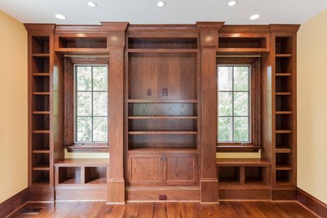 Stained wood custom built in with window seats, bookcases, and media storage in custom home study by BCN Homes in Arlington, Virginia. Built In Bookcase Around Window, Builtin Bookshelves, Farmhouse Life, Living Room Upgrades, Slope House, Stained Window, Arlington Virginia, Window Seats, Ceiling Treatments