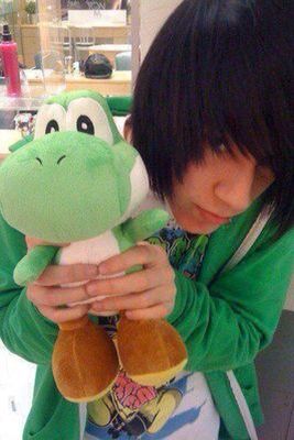 Cute  boy holding a  yoshi plushie Holding Plushie, Coco, Green