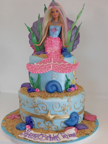 Mermaid Barbie Cake (2164)...love the gold starfish & swirl accents and shell barbie backdrop! Mermaid Barbie Cake, Doll Birthday Cake, Barbie Birthday Cake, Barbie Doll Cakes, Mermaid Birthday Cakes, Mermaid Barbie, Cinderella Cake, Pink Birthday Cakes, Barbie Birthday Party