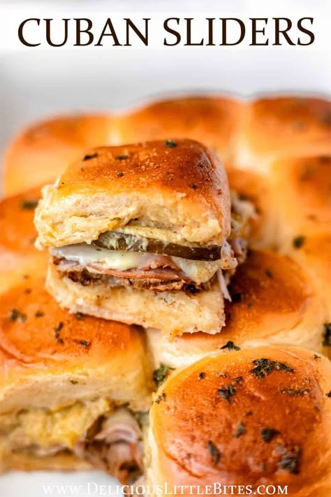 Cuban Sliders, made with traditional Cubano sandwich ingredients, will hit the spot every time. This recipe is a quick, fun appetizer or snack that is full of flavor from roasted pork, ham, Swiss cheese, pickles and mustard. A brush of butter and herbs creates a delicious garlic bread flavor on top of the sweet Hawaiian rolls they are made on. Cuban Sandwich Sliders Kings Hawaiian, Cubano Sliders Hawaiian Rolls, Cuban Recipes Sandwich, Hawaiian Bread Recipes Sandwiches, Cuban Sliders Hawaiian Rolls, Pork Sliders Hawaiian Rolls, Cubano Sliders, Pork Loin Sliders, Hawaiian Bread Sandwiches