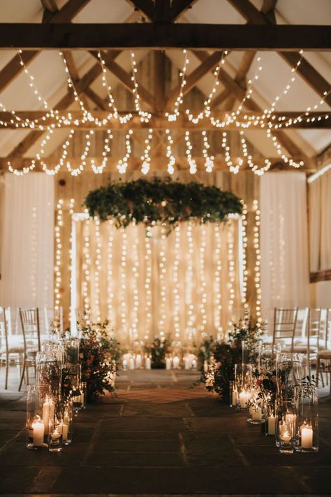 Charlotte and Steven's aisle was covered in candles and twinkling lights. Photo: @elizabethrosephotographer Fairy Lights Wedding Ceremony, Winter Wedding Fairy Lights, Fairy Lights And Candles Wedding, Barn Wedding Fairy Lights, Fairy Lights At Wedding, Candle Altar Wedding, Small Barn Wedding Ideas, Fairy Lights Wedding Decor, Wedding Ceremony Lights