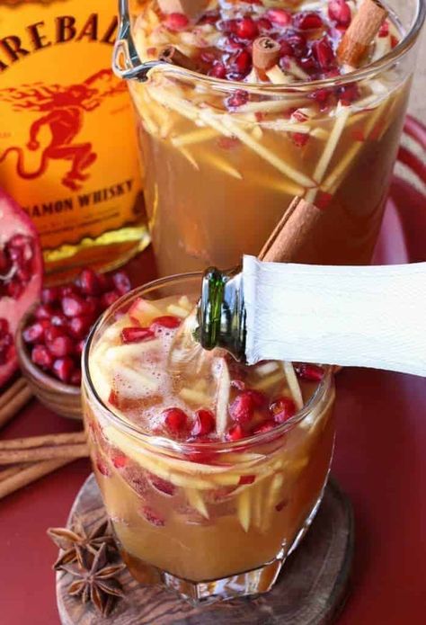 Top this Sparkling Fireball Apple Sangria with prosecco, sparkling cider or plain seltzer! #sangriarecipe #cocktailrecipe #cidercocktails #fireballwhiskey Christmas Sangria Recipes, Apple Cider Sangria Recipe, Fall Sangria Recipes, Sparkling Apple Cider, Christmas Drinks Alcohol Recipes, Christmas Sangria, Apple Sangria, Cider Sangria, Apple Cider Sangria