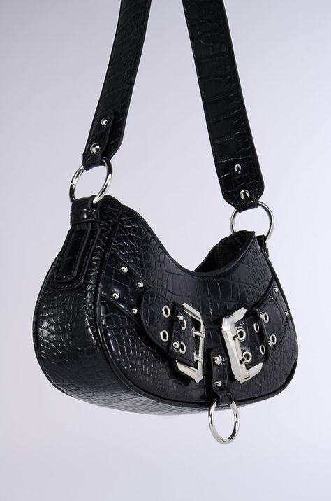 The AKIRA Label Buckle Up Purse is a chic baguette purse crafted from a textured faux leather upper. It boasts decorative, moto-inspired buckles and metallic accents, a roomy, lined interior with a small zip pocket, a zip top closure, and a wide shoulder strap with silver O-ring attachments. Wear it with any outfit to add some edge.  - 100% Man-Made Materials  - Imported (all measurements approximate from size O/S) - 11.5” Body Length, 2.5” Width, 5.5” Height - 19” Strap Product ID: 423765 Edgy Handbags, Edgy Purse, Baguette Purse, Purse Crafts, Metallic Accents, Zip Top, O Ring, Zip Pockets, Leather Upper