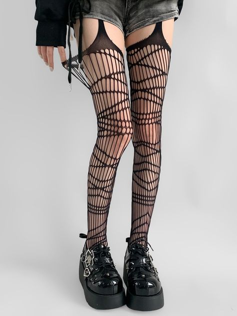 Step into the world of edgy elegance with our Asymmetrical Black Fishnet Suspender Tights. Break away from the ordinary with an eye-catching asymmetrical design that adds a touch of avant-garde flair to any outfit. Classic black fishnet material blends sophistication with a hint of rebellion. Built-in suspender straps offer a sexy, thigh-high illusion. Fishnet Thigh Highs Outfit, Ripped Fishnet Tights, Layered Fishnets, Grunge Stockings, Emo Tights, Thigh Highs Outfit, Stockings With Suspenders, Fishnets And Boots, Fishnet Outfits