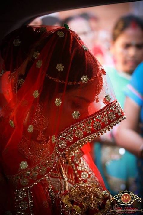 A wedding dress is both an intimate and personal for a woman - it must reflect the personality and style of the bride.  Subh Muhurat perfectly captured the emotional Vidaiy moment of the Indian Bride  for more info visit : www.wedamor.com  #wedding #weddingdress #redlehanga #bridalphoto #bride #vidaiy #wedamor #photography #subhmuhurat #knittheknot #brideportrait #indianbride #indianwedding #traditionaldresses #indianculture #lehenga #fashion #bridalwear #wedamor #weddingdress #indianwedding #we Bridal Entry, Traditional Photography, Princess Videos, Bride Entry, Bride Photos Poses, Punjabi Couple, Indian Wedding Photography Poses, Photography Packages, Best Wedding Photography