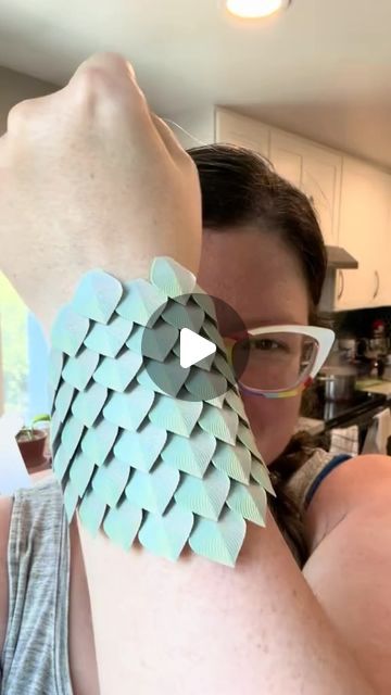 Alyssa Long on Instagram: "Youngest wants to be a dragon (a Bluey dragon, specifically) for Halloween, so we’ve been experimenting and making real cool stuff out of dragon scales this week! I have to make some tweaks (I want it to be stretchy so I need to figure out how to do that), but one of the interns *immediately* smacked my wrist to test this one out and it turns out it IS pretty good armor 😂 
#dragons #dragonscales #dragonjewelry #3dprinting" How To Make A Dragon Tail, Diy Dragon Tail, Dragon Scales Diy, Diy Dragon Scales, How To Make Dragon Scales, How To Make A Dragon Scale Tumbler, Dragon Scale Shoulder Armor, Dragon Scale Fabric, Dragon Scale Armor