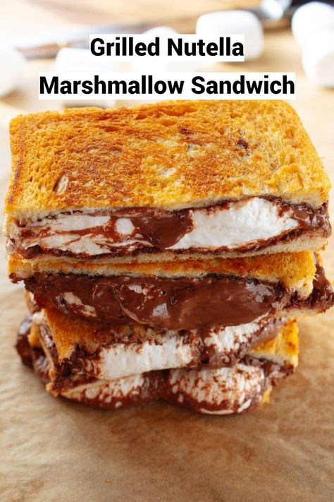 This Grilled Nutella Marshmallow Sandwich is THE perfect comfort food and indulging dessert when you just need something sweet and gooey. Treat yourself to a sandwich that has a fluffy marshmallow melted chocolatey filling and crispy sandwich bread on the outside. It is simply delicious. Marshmallow Sandwich, Dessert Sandwich, San Diego Food, Sandwich Ingredients, Chocolate Hazelnut Spread, Marshmallow Creme, Sandwich Recipe, Sandwich Bread, Graham Cracker Crumbs