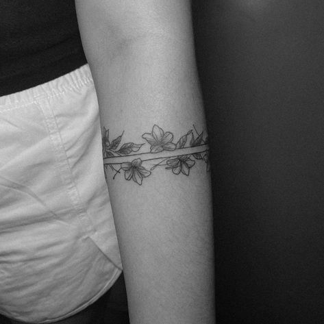 An armband tattoo featuring sampaguita flowers often carries cultural and personal significance. The sampaguita, also known as the Philippine jasmine, is the national flower of the Philippines. It symbolizes purity, simplicity, humility, and strength. In the context of an armband tattoo, it may represent pride in Filipino heritage, a connection to one’s roots, or the embodiment of the qualities that the flower symbolizes. Additionally, armband tattoos can signify continuity, protection, and l... Sampaguita Tattoo Philippines, Armband Tattoo For Women, Sampaguita Tattoo, Sampaguita Flower Tattoo, Tattoo Philippines, Traditional Filipino Tattoo, Philippines Tattoo, Filipino Tattoo, Tats Ideas