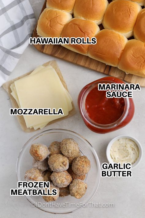 Meatball sliders will put extra fun into any game day gathering. This quick and easy recipe is a cinch made from frozen meatballs, simmered in a rich marinara sauce. Slide them onto Hawaiian rolls brushed with garlic butter, top with shredded mozzarella, and enjoy! This hot and hearty snack will keep family and guests satisfied for hours. #meatballsliders #meatballslidersrecipe #idonthavetimeforthat #hawaiianrollmeatballsliders Italian Meatball Sliders Hawaiian Rolls, Frozen Meatball Sliders Hawaiian Rolls, Easy Meatball Sandwiches, Meatball Bombers Recipe, Frozen Meatball Sliders, Hawaiian Meatball Sliders, Easy Meatball Sliders Hawaiian Rolls, Meatball Hawaiian Rolls Sliders, Kings Hawaiian Meatball Sliders