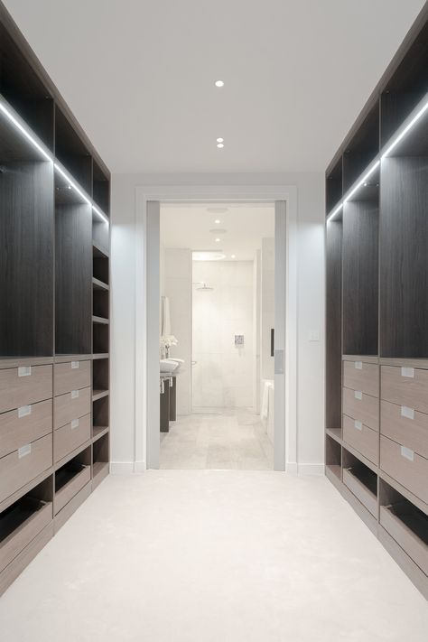 Dark wood walk in, walk through wardrobe to ensuite bathroom by Neatsmith with LED strip lighting. White and dark interiors.  #Monochrome #White #Dark #Wardrobe #Luxury #DressingRoom #MasterSuite #Ensuite #DreamWardrobe #Minimalist #Decor #Monochromedecor #Closet Walk Through Wardrobe To Ensuite, Walk Through Wardrobe, Ensuite Bathroom Designs, Mini Closet, Dark Wardrobe, Walk Through Closet, Wardrobe Aesthetic, Dream Closet Design, Walk In Closet Design