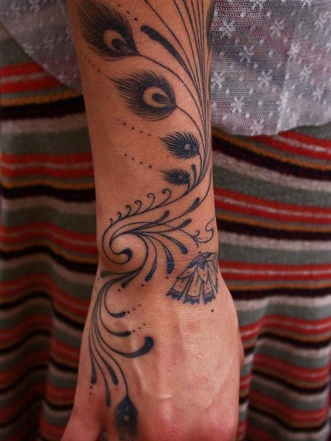 I like this a lot, very clean design Peacock Bird Tattoo, Peacock Hand Tattoo, Tattoos Peacock Feather, Peacock Feather Finger Tattoo, Tattoo Of Peacock Feather, Peacock Feather Hand Tattoo, Peacock Arm Tattoo, Peacock Feather Tattoo Meaning, Peacoke Feather Tattoos