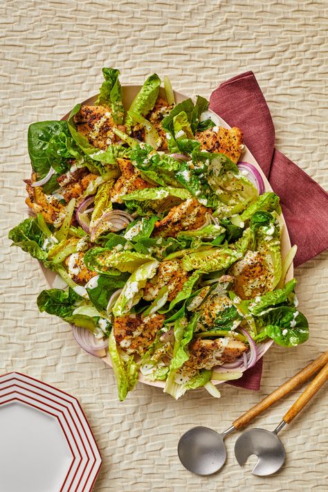 We've transformed the beloved lemon pepper chicken wings into a satisfying salad that comes together in just 20 minutes. Skinless, boneless chicken thighs coated in a lemon pepper spice blend take the place of wings and cook in a flash under the broiler. During the brief down time, prep Little Gem lettuce, celery, and a creamy dressing for drizzling and spreading on the bottom of the platter. It delivers all the joy of wing night with none of the deep-frying. Broiled Chicken Thighs, Lemon Pepper Chicken Wings, Satisfying Salads, Broiled Chicken, Pepper Spice, Lemon Pepper Chicken, Pepper Chicken, Lemon Pepper, Chicken Salad Recipes