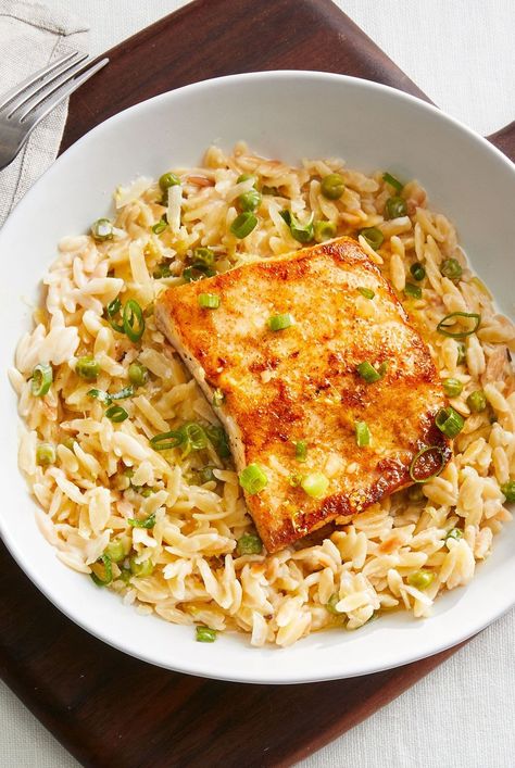 Zesty fish fillets are beautifully paired with a creamy side dish in this easy weeknight dinner. Fish With Orzo, Real Simple Magazine Recipes, Light Entrees, Easy Easter Dinner, Longevity Recipes, Cook Fish, Recipes Fish, How To Cook Orzo, Magazine Clippings