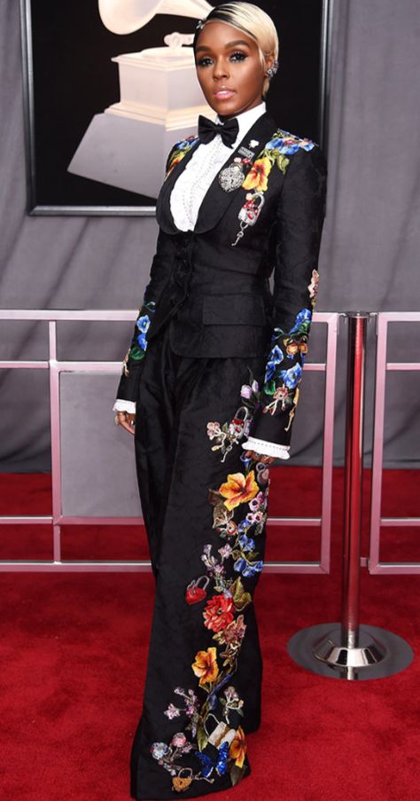 In the image above is singer Janelle Monae on the Red Carpet at the 2018 Grammys. She represents black and female dandyism. The floral design is especially unique to the suit because many people choose to style them with a checkered or striped pattern. Grammy Awards Red Carpet, Grammys Red Carpet, Janelle Monae, Janelle Monáe, Best Red Carpet Looks, Red Carpet Look, It Goes On, Red Carpet Looks, Grammy Awards