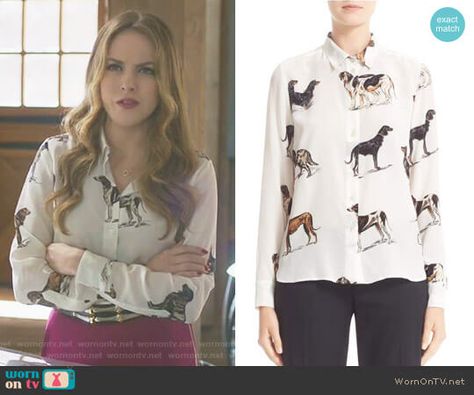 Fallon’s white dog print blouse on Dynasty.  Outfit Details: https://wornontv.net/80743/ #Dynasty Fallen Carrington, Dynasty Outfits, Fallon Carrington, Tv Show Outfits, Elizabeth Gillies, Printed Silk Blouses, White Dog, Diva Fashion, Work Attire