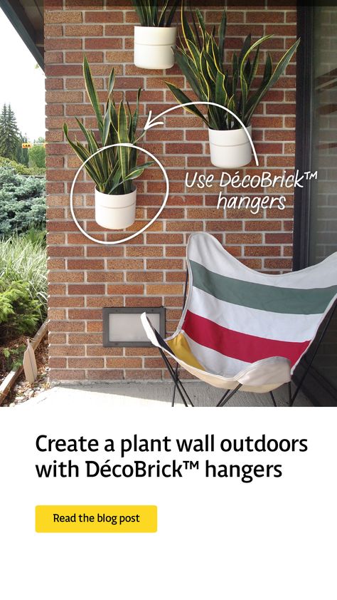 Photo of a plant wall we created on our outdoor bricks using DécoBrick hangers. Diy Wall Planter Outdoor Plant Hangers, Living Plant Wall, Brick Wall Decor, Indoor Plant Wall, Wall Mounted Planters, Hanging Plant Wall, Summer Happy, Beautiful Outdoor Spaces, Spider Plants