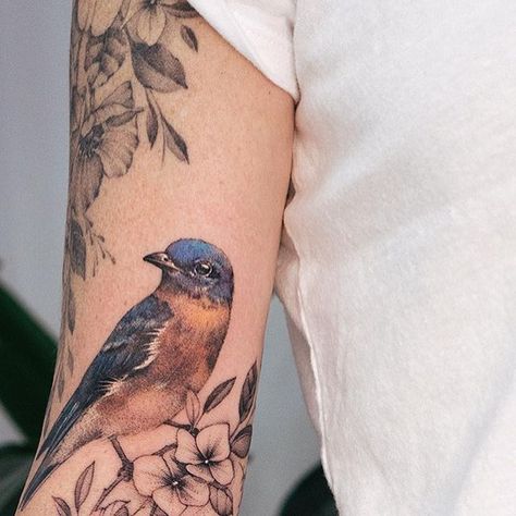 Ola Grigorev | tattoo artist on Instagram: "Floral extension for Amanda, thank you for coming from US, again! The top part done a year ago. I’m not a big fan of mixed techniques, but that colour on the bird looks so cute 🥰 flowerstattoo #bluebird #peonytattoo" Western Bluebird Tattoo, Mountain Bluebird Tattoo, Blue Bird Tattoo Black And White, Eastern Bluebird Tattoo, Fly Tattoos, Blue Bird Tattoo, Moms Tattoo, Blue Jay Tattoo, Seed Tattoo