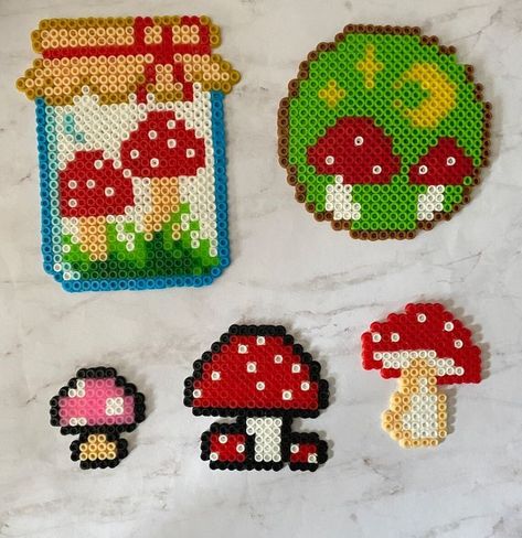 Mushroom perlers Mushroom Pearl Beads, Fuse Beads Mushroom, Mushroom Melty Bead Patterns, Cute Bead Art Ideas, Peeler Bead Mushroom, Perler Bead Cup Cover, Small Mushroom Perler Bead Patterns, Mini Mushroom Perler, Bead Melting Crafts