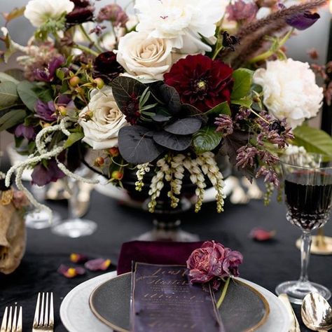 Halloween inspired tablescape, Forbidden Love. This table features a dark black velvet linen paired with wine colored napkins, gold flatware, brass candlesticks with black candles, and dainty wine-filled crystal glassware. Wedding Table Decorations Candles, Wedding Table Vases, Dark Romantic Wedding, Wedding Table Decorations Centerpieces, Dark Wedding Theme, Rustic Wedding Table Decor, Candle Table Decorations, Tafel Decor, Gold Flatware