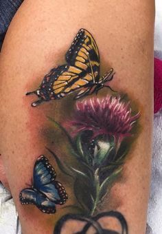 Ryan Mullins - Realistic color butterflies with thistle flower. Ryan Mullins Art Junkies Tattoo Tattoo With Butterfly, Thistle Flower Tattoo, Scotland Tattoo, Scottish Thistle Tattoo, Scottish Tattoo, Scottish Tattoos, Butterfly Tattoos Images, Butterfly With Flowers Tattoo, Thistle Tattoo