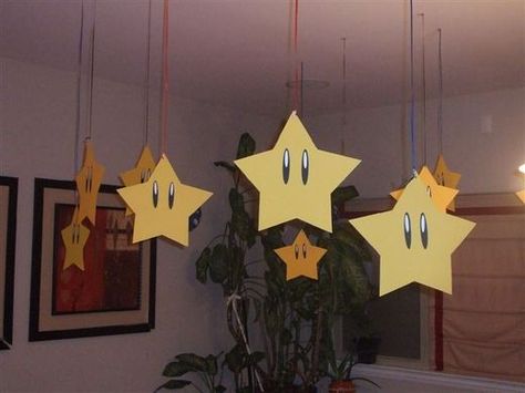 Super Mario Birthday Party DIY Decoration Ideas.  Stars hung from the ceiling. Mario Und Luigi, Mario Kart Party, Princess Peach Party, Mario Bros Birthday Party Ideas, Nintendo Party, Super Mario Bros Birthday Party, Mario E Luigi, Super Mario Bros Party, Birthday Party Table Decorations