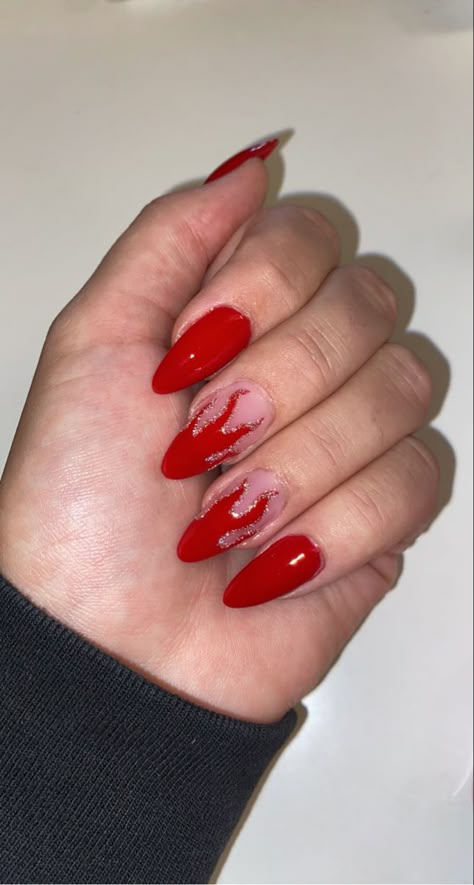 Red flame design nails with glitter accents Fire Red Nails Design, Red Nails Flame Design, Nails That Match Red Hair, Red Nails Fire Design, Red And Orange Flame Nails, Red Concert Nails, Red Vegas Nails, Fun Red Nail Designs, Flame Almond Nails