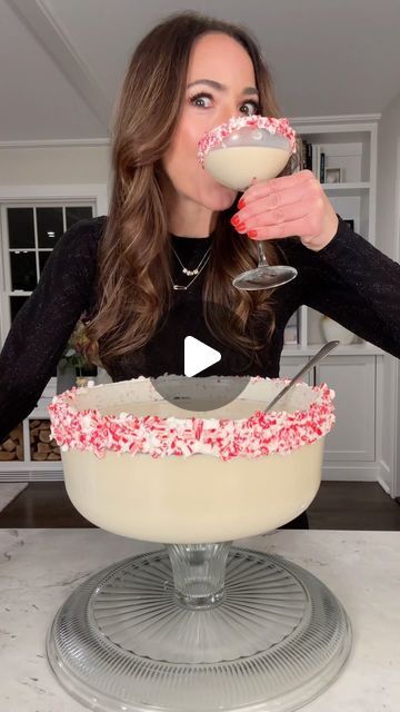 Ereka Vetrini on Instagram: "Holiday Cake Stand Cocktail 2023! Cheers! Salute! Cin-cin! Ingredients: -⅓ cup vanilla frosting -1 ½ cup crushed candy canes -750 ml vanilla Vodka -750 ml @baileysofficial -¼ cup powdered sugar -½ gallon milk of choice. I used oat milk -200 ml amaretto liquor -Invert a cake stand as shown. Add crushed candy canes to a flat dish. -Rim the edge with frosting and coat with crushed candy canes -Fill a large pitcher ½ way with ice. -Add all ingredients to the pitcher and mix well. -Using a colander, strain the ingredients into the inverted cake stand as shown." Cake Stand Cocktail, Candy Cane Martini, Holiday Cake Stand Cocktail, Cocktails And Candy Canes Party, Candy Cane Cocktail Recipe, Tito’s Christmas Cocktail, Parmesan Crusted Potatoes, Creamy Cocktails, Vanilla Vodka