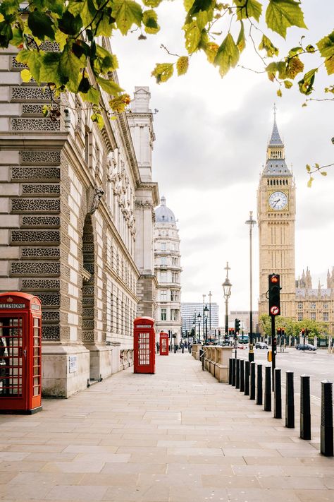 Red phone booths used to be all over the city, but these days there are less and less – and further between them. The best way to catch a lot of these distinctive little boxes in one shot (with a great backdrop too) is on Great George Street in Westminster. There's a booth every few steps with a view of Big Ben in the background.   [i]Great George Street, Westminster, London SW1P 3AD[/i] London Wallpaper, Big Ben Clock, Westminster London, London Aesthetic, Big Ben London, Chrysler Building, City Of London, London Places, Voyage Europe