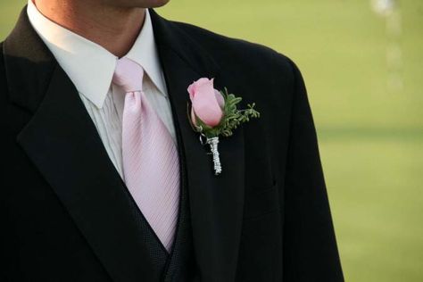 Pink rose boutonniere, silver wrapped, pink and black wedding Black Suit With Pink Accents, Pink And Black Suit, Black And Pink Tuxedo Wedding, Black Suit Pink Tie, Black Suit With Pink Tie, Black Tuxedo With Pink Bow Tie, Groom Black Suit Pink Tie, Groomsmen Black Suit Pink Tie, Black Tux Pink Bow Tie