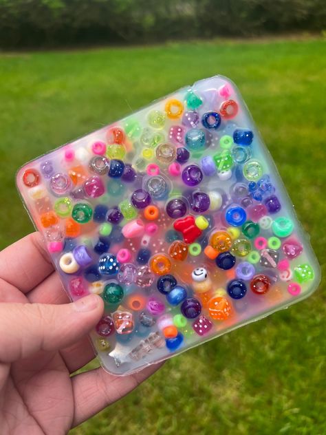 Picky Pads made with a variety of beads Made with silicone rubber SMALL BEADS INCLUDED CAN BE CHOKING HAZARD , NOT FOR SMALL CHILDREN  *Bead choice may vary from pictures* Picky Pad Diy, Homemade Fidgets, Picky Pad, Pony Bead Jewelry, Bubble Blowing Toys, Magic Ideas, Pet Frogs, Bonfire Party, Arte Doodle