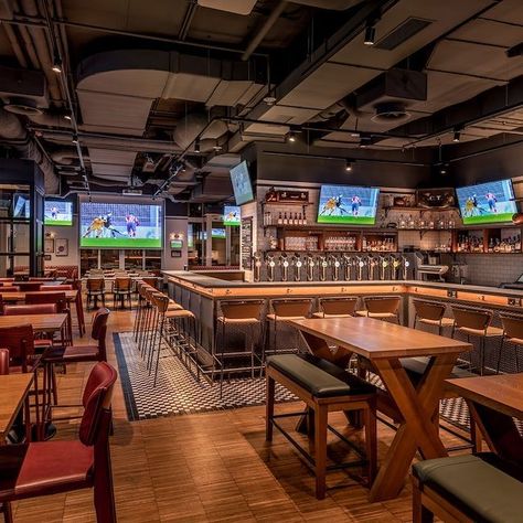 Sports Bar Restaurant Design, High End Sports Bar Design, Bar Design Ideas Pub, Sports Bars Ideas, Sports Cafe Design, Sports Cafe Interior, Industrial Sports Bar, Sports Pub Interior, Sport Bar Ideas