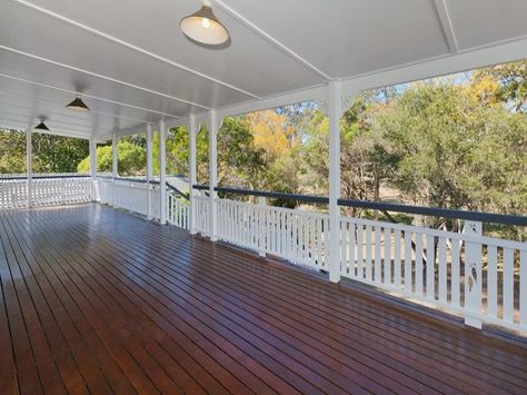 Large wrap around verandah in a Queenslander style home. #decks #verandahs Wrap Around Verandah, Renovated Queenslander, Future Farms, Wrap Around Porch, Farmhouse Exterior, Classic House, Mobile Home, Selling House, House Front