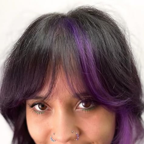 Purple Highlights With Bangs, Peekaboo Hair Color Layers, Purple Hair Streaks Brown, Color Streak In Hair, Layered Purple Hair, Purple Streak In Hair, Purple Curtain Bangs, Purple Peekaboo Highlights For Dark Hair, Purple Streak In Brown Hair