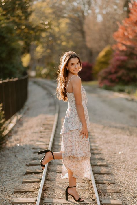 Teen girl poses for her senior pictures with Blythe Photo on small train tracks at a park in Raleigh NC. Track Senior Pictures, Cap And Gown Photos, Senior Photoshoot Poses, Senior Photography Poses, Senior Portrait Poses, Newborn Photography Poses, Senior Photo Poses, Senior Photo Outfits, Best Shots