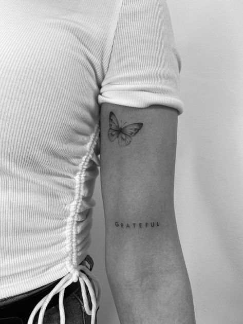 Tattoo Beautiful Word, Back Arm Word Tattoo, Small Word Tattoos Arm, Fine Line Tattoos On Arm, Words On Bicep Tattoo, Grateful Quotes Tattoo, Grateful Arm Tattoo, Word And Butterfly Tattoo, Family Simple Tattoo