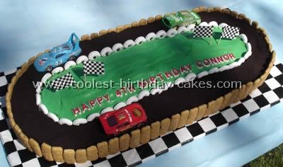 Making this for Paddy's birthday, although I will do grass on the side instead of graham crackers and try to pipe a trophy on the field, checkered finish line on the track, and possibly a checkered 5 on the field. Race Cars Cake, Race Track Cake, Lightning Mcqueen Cake, Race Car Cakes, Mcqueen Cake, Disney Cupcakes, Cars Birthday Cake, Cars Cake, Diy Birthday Cake